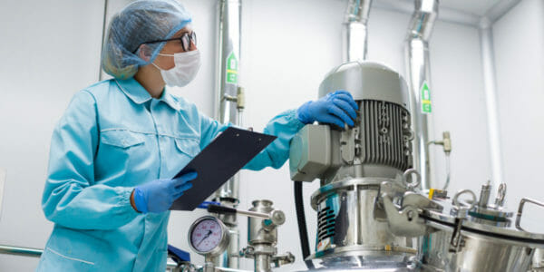 scientist monitors the readings on the equipment